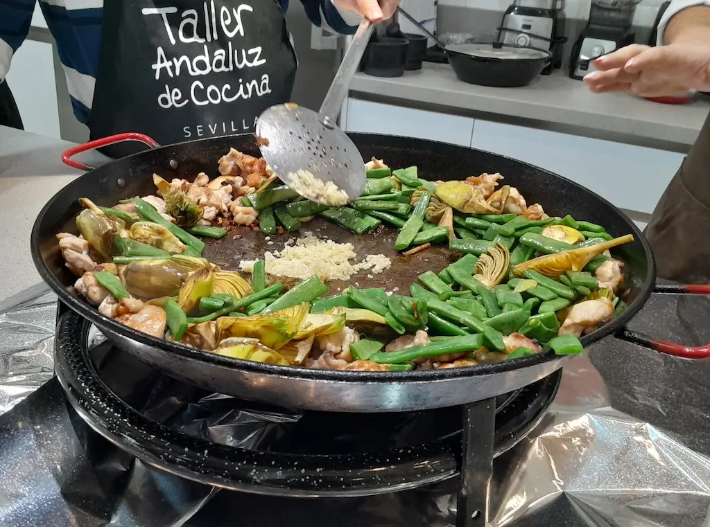 Learn how to cook paella in the Spanish Cooking Class & Triana Market Tour