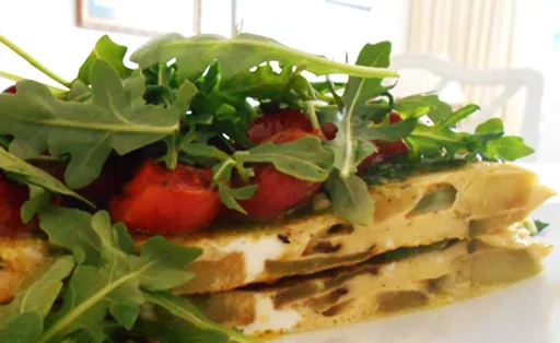 Courgette Tortilla served with Pesto and Rocket Leaves